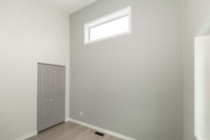 Portfolio 13 bedroom-grey-accent-wall-high-window-trade-grade-painting