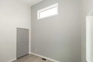 Portfolio 13 bedroom-grey-accent-wall-high-window-trade-grade-painting